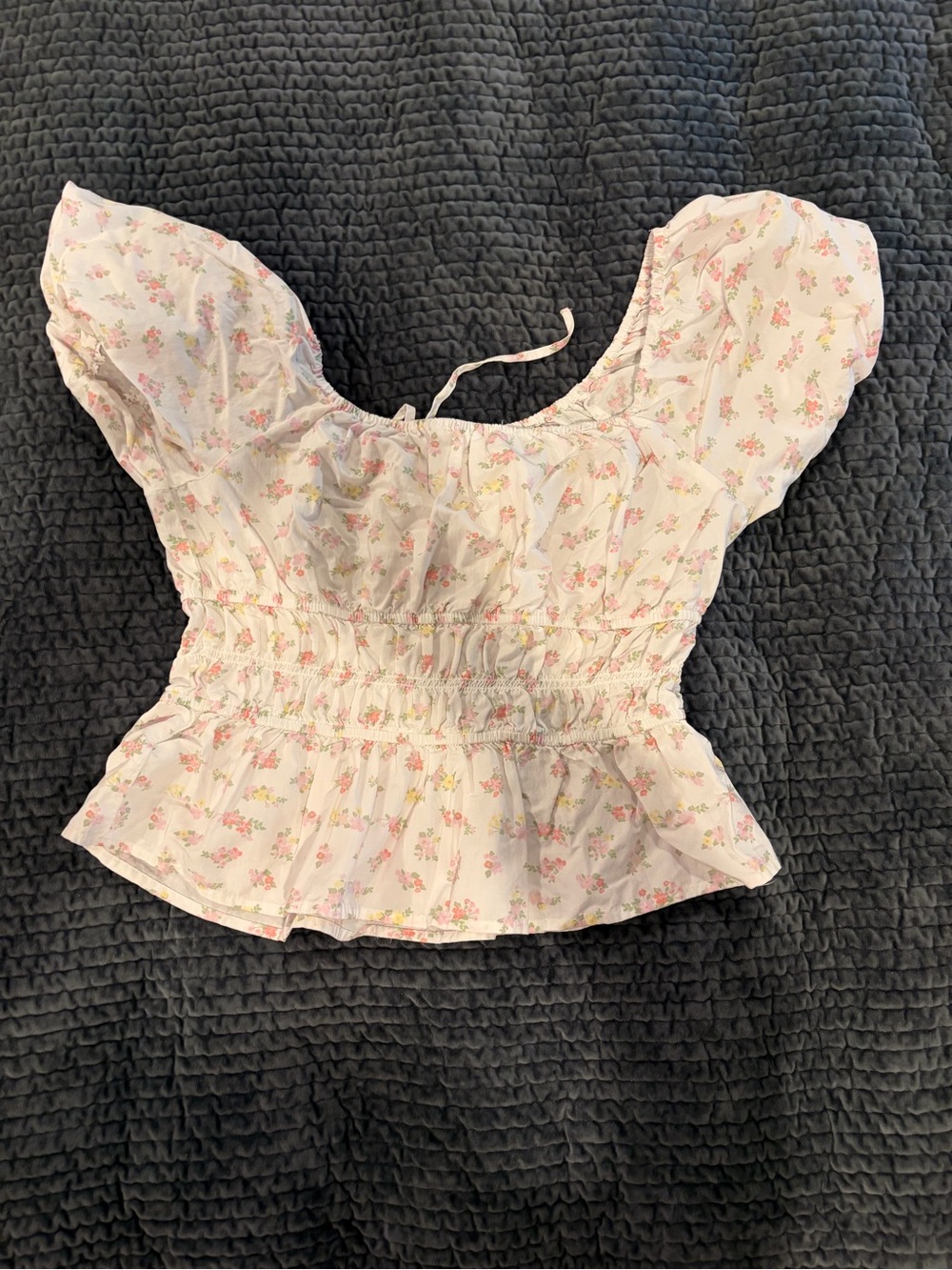 Celebrity Pink Floral Smocked Peplum Blouse in Light Pink